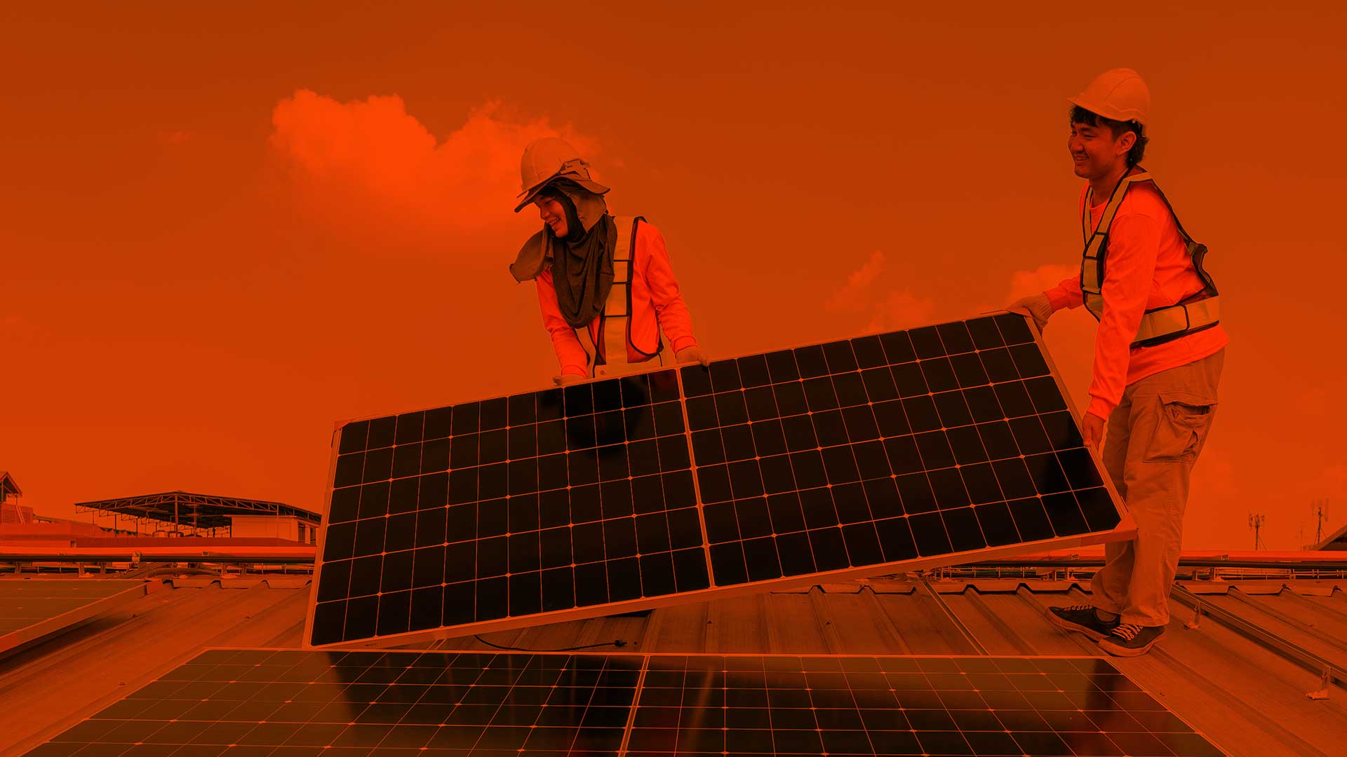 men installing solar panels on roof